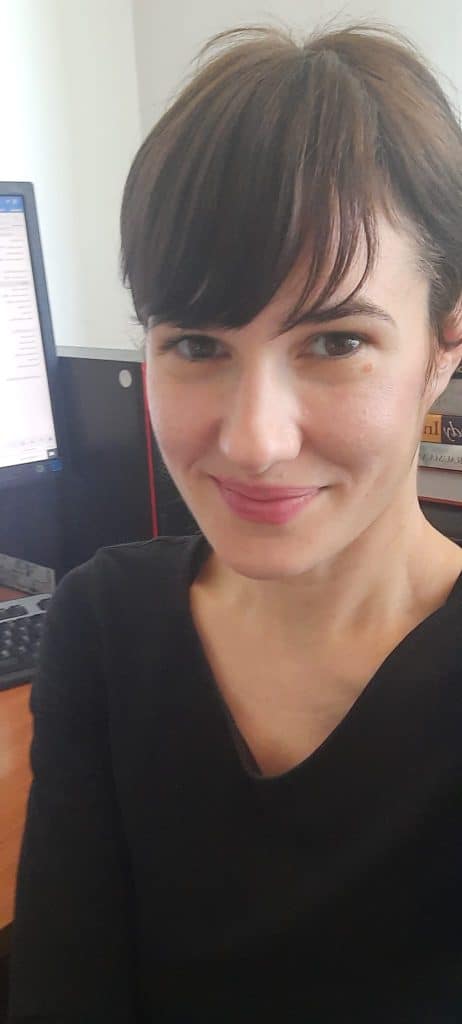 Psychologist Ivana Glavina Jelas in her office, smiling, with a computer in the background.